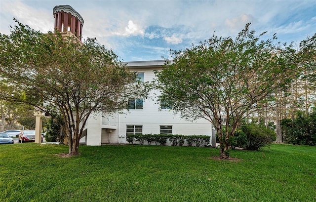 view of front of home with a front yard