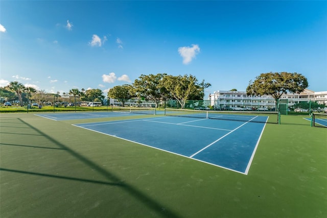 view of tennis court featuring basketball court