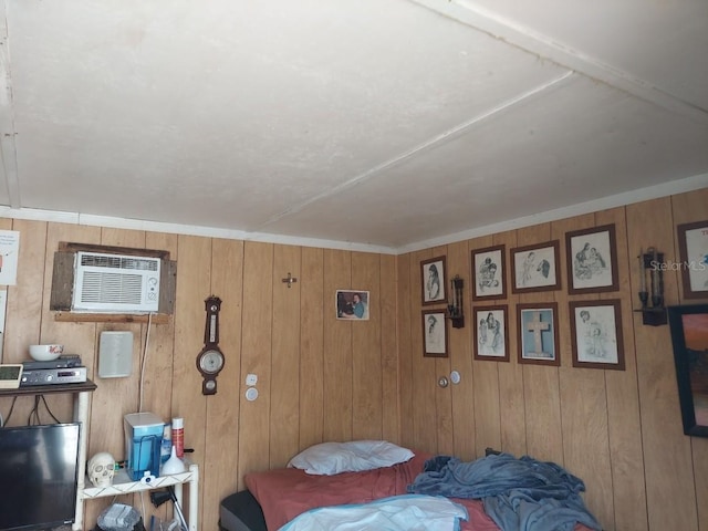 bedroom with wood walls