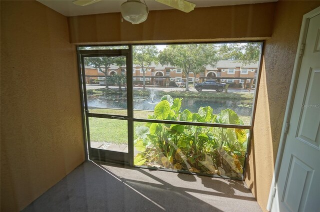 sunroom with a water view