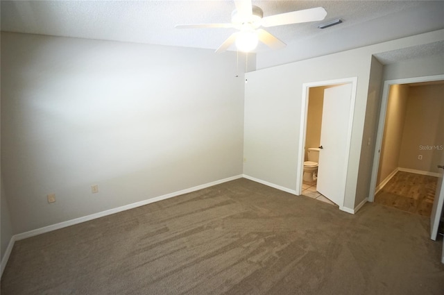 spare room with ceiling fan and carpet floors