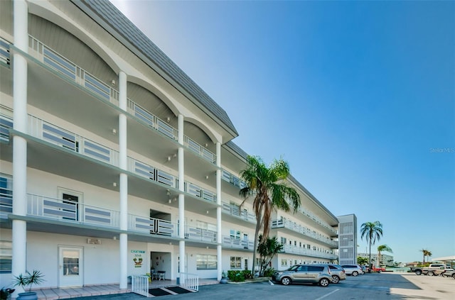 view of property featuring uncovered parking