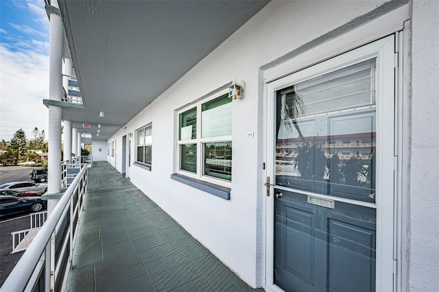 doorway to property with stucco siding