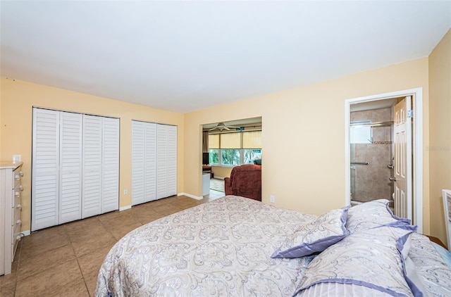 bedroom with light tile patterned floors, baseboards, multiple closets, and ensuite bathroom