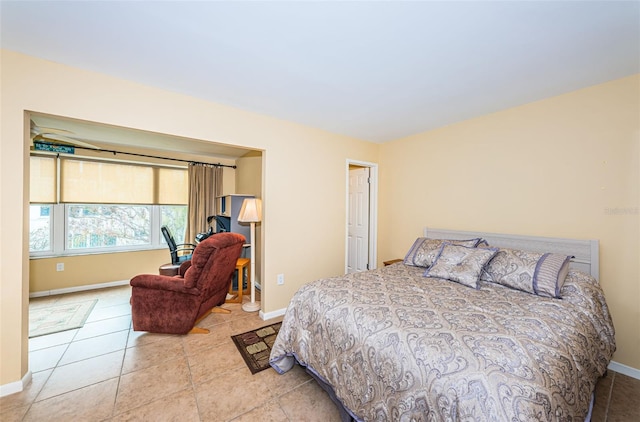 bedroom featuring light tile patterned flooring