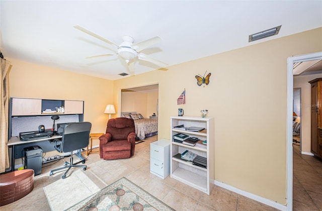 office featuring ceiling fan and light tile patterned flooring