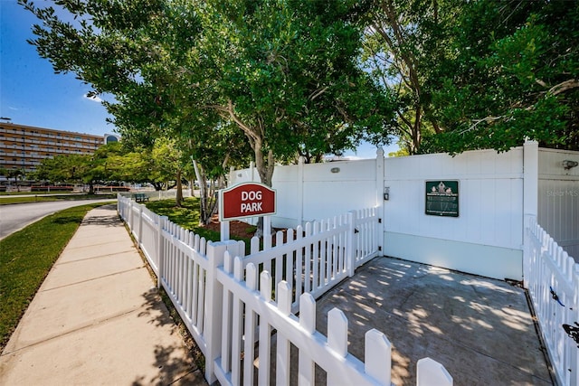 view of home's community with fence