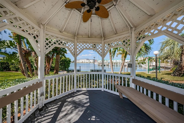 wooden terrace featuring a gazebo and a water view