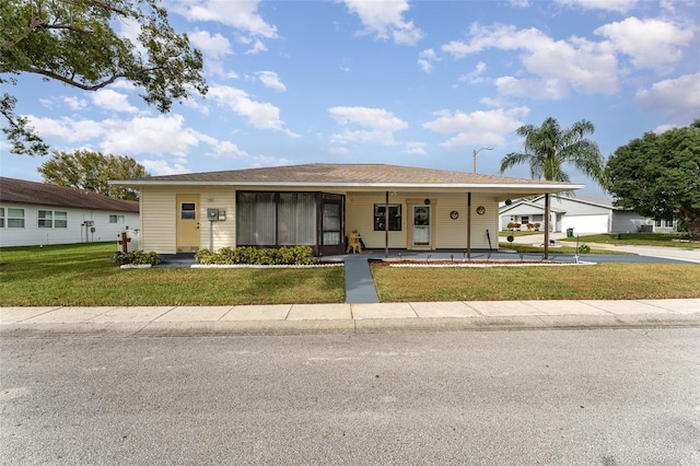 single story home with a carport and a front yard