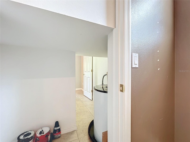 corridor with light tile patterned floors