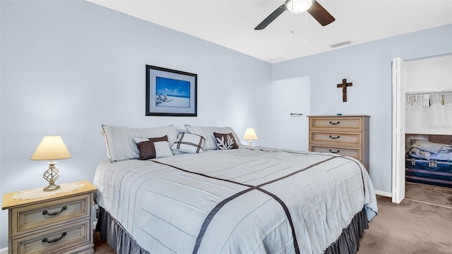 bedroom featuring light colored carpet and ceiling fan