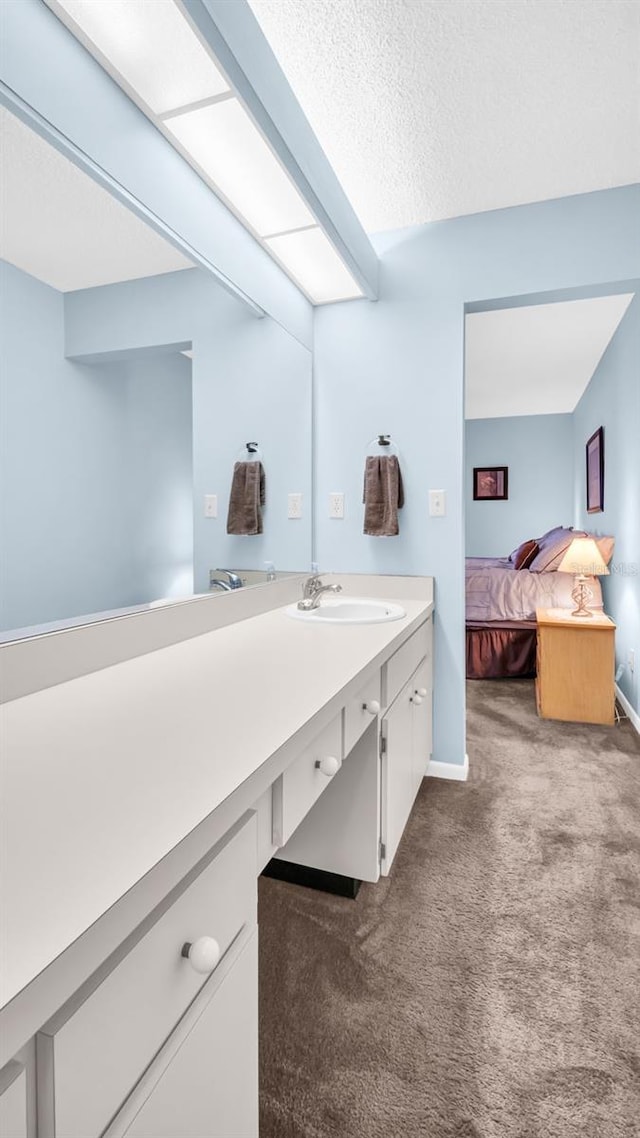 bathroom featuring vanity and a textured ceiling