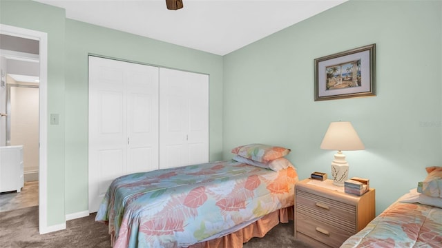 carpeted bedroom featuring a closet and ceiling fan