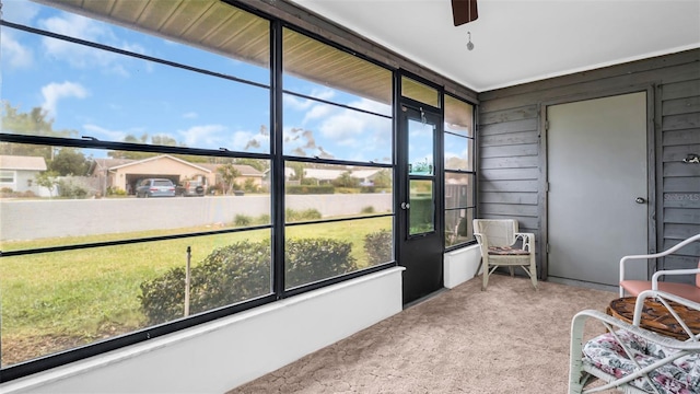 sunroom with ceiling fan and a healthy amount of sunlight