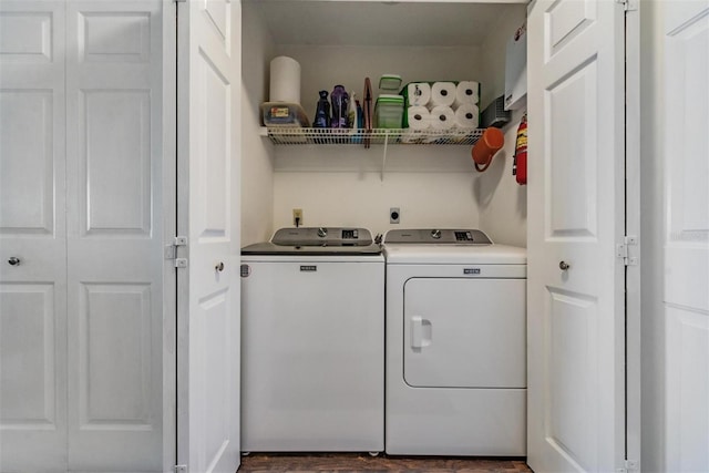 laundry area with washing machine and clothes dryer