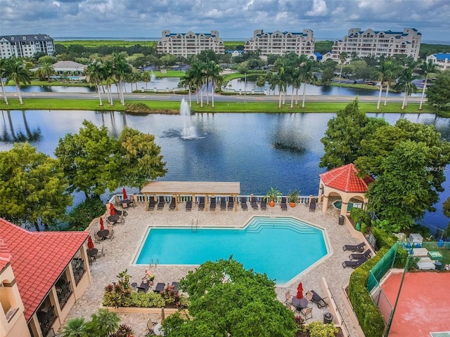 view of pool with a water view