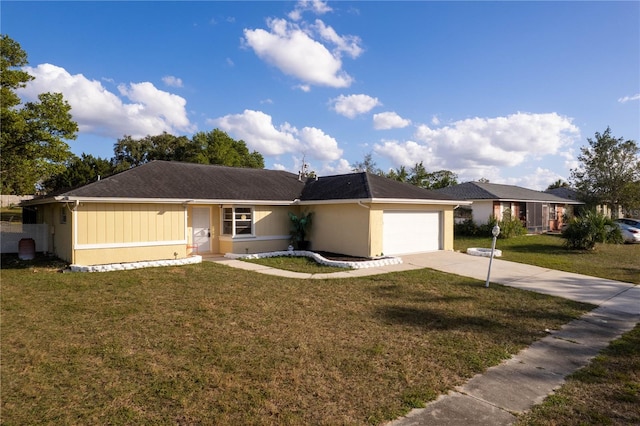 ranch-style home featuring a garage and a front lawn