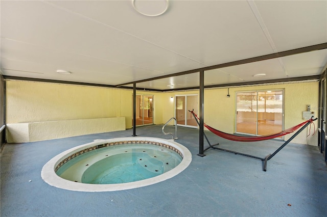 view of pool featuring an indoor hot tub