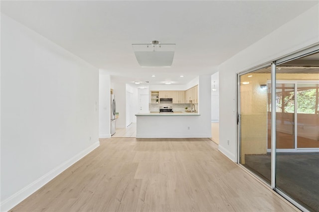 unfurnished living room featuring light hardwood / wood-style floors