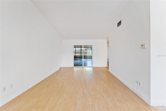 spare room with light hardwood / wood-style floors