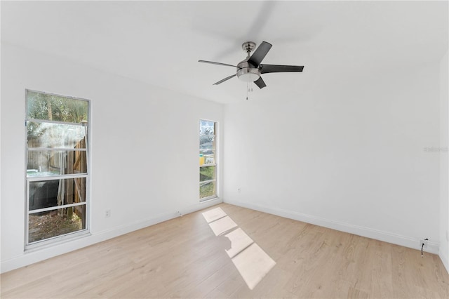 empty room featuring ceiling fan and light wood-type flooring