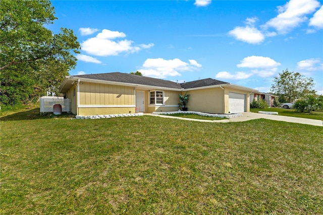 ranch-style house featuring a front lawn and a garage