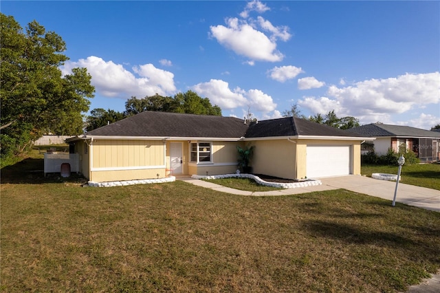 single story home featuring a garage and a front yard