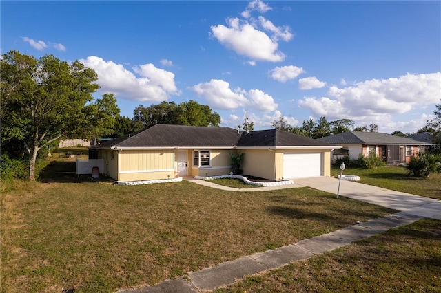 ranch-style home with a garage and a front yard