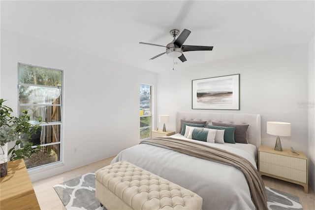 bedroom featuring light hardwood / wood-style flooring and ceiling fan