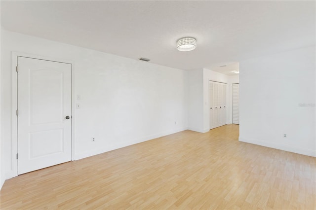 unfurnished room featuring light hardwood / wood-style flooring