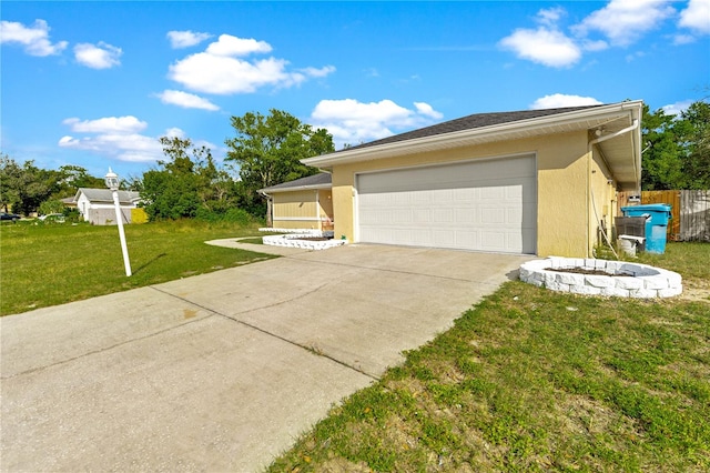 view of property exterior featuring a lawn and a garage