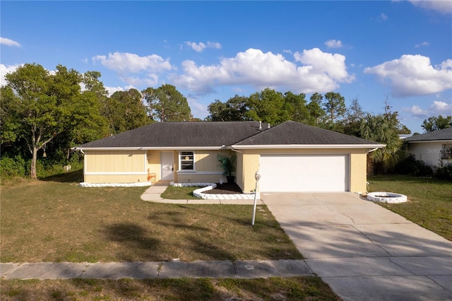 ranch-style house featuring a garage and a front lawn