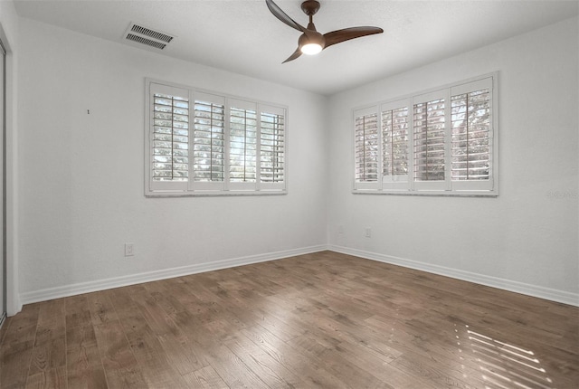 unfurnished room with hardwood / wood-style floors and ceiling fan