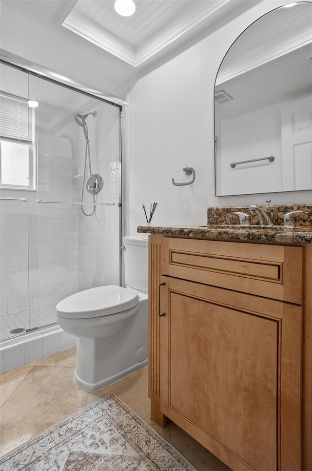 bathroom with ornamental molding, vanity, an enclosed shower, toilet, and a tray ceiling