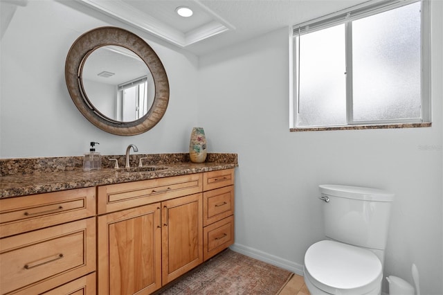 bathroom featuring tile patterned flooring, vanity, and toilet