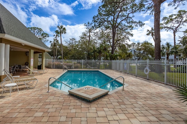 view of swimming pool with a patio area