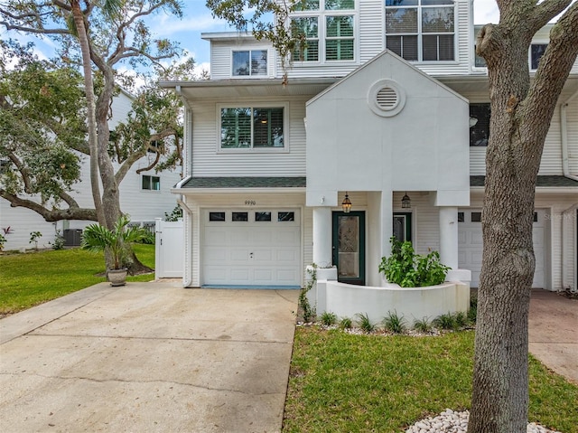 view of front of property with a garage and a front yard