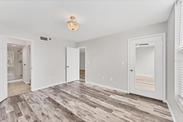 empty room with hardwood / wood-style floors