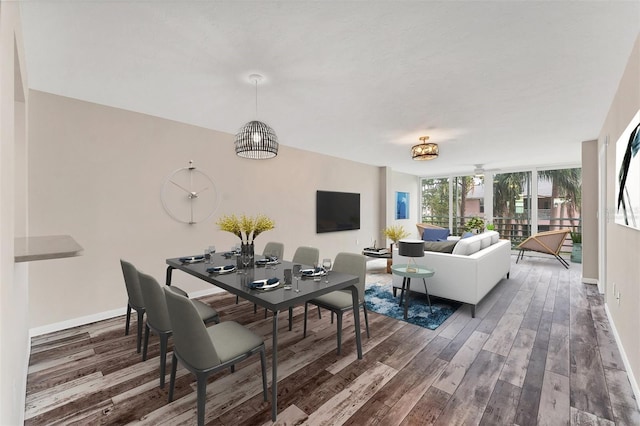 dining space with dark wood-type flooring