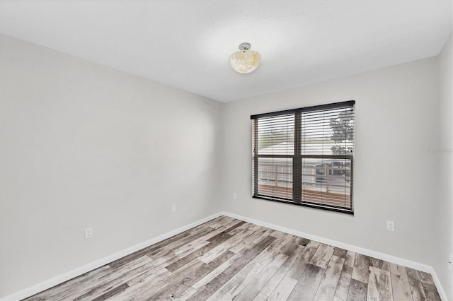 unfurnished room featuring light hardwood / wood-style flooring