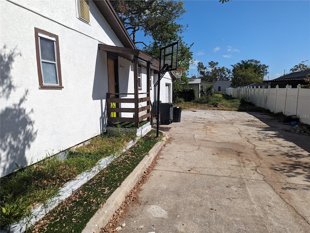 view of property exterior with a patio area