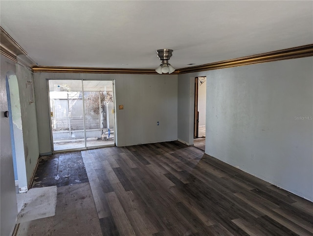 interior space with dark hardwood / wood-style floors, crown molding, and ceiling fan