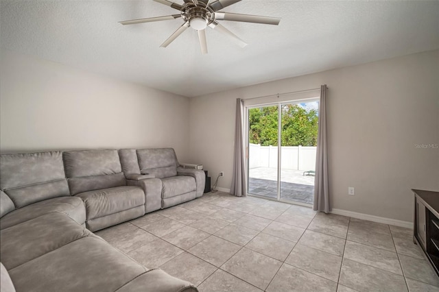 unfurnished living room with ceiling fan, a textured ceiling, and light tile patterned floors