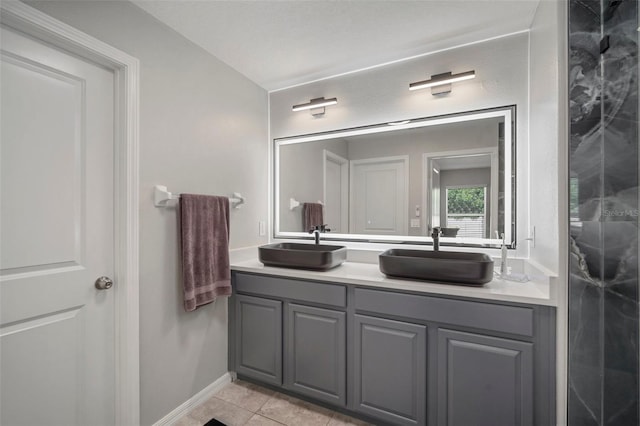 bathroom with tile patterned flooring and vanity