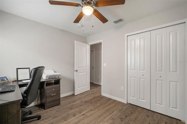 office featuring hardwood / wood-style floors and ceiling fan