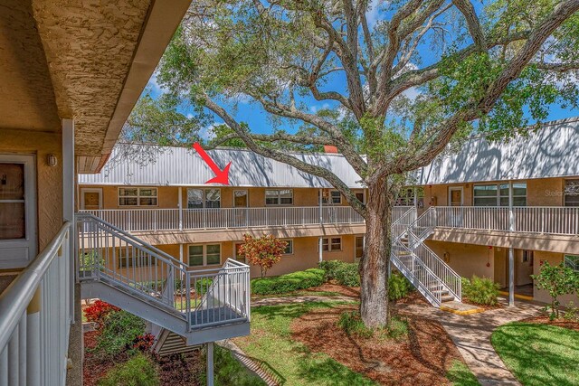 10036 63rd Ave N Unit 23, Saint Petersburg, FL 33708 - view of property's community featuring stairway