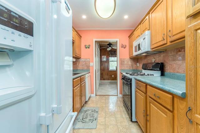 10036 63rd Ave N Unit 23, Saint Petersburg, FL 33708 - kitchen with white appliances, tasteful backsplash, a ceiling fan, crown molding, and brown cabinets