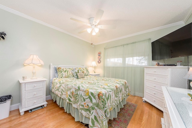 10036 63rd Ave N Unit 23, Saint Petersburg, FL 33708 - bedroom with light wood-style floors, ornamental molding, ceiling fan, and baseboards