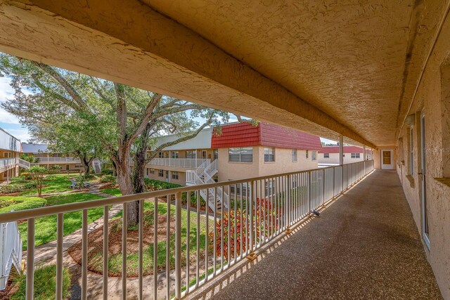 10036 63rd Ave N Unit 23, Saint Petersburg, FL 33708 - view of patio featuring a residential view and a balcony