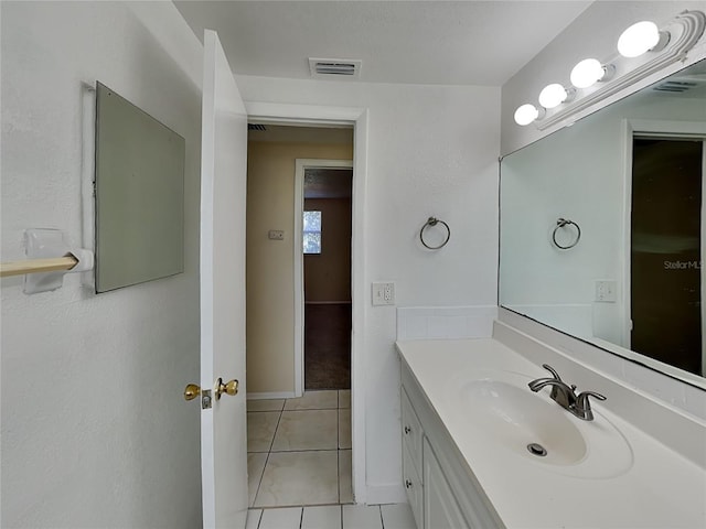 bathroom with vanity and tile patterned flooring